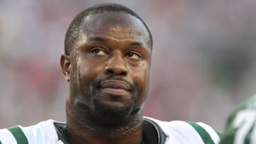 FOXBORO, MA - OCTOBER 09: Linebacker Bart Scott #57 of the New York Jets stands on the sideline against the New England Patriots at Gillette Stadium on October 9, 2011 in Foxboro, Massachusetts. The Patriots defeated the Jets 30-21. (Photo by Al Pereira/New York Jets/Getty Images)