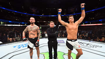 CLEVELAND, OH - SEPTEMBER 10: (R-L) Mickey Gall celebrates after defeating Phil 'CM Punk' Brooks in their welterweight bout during the UFC 203 event at Quicken Loans Arena on September 10, 2016 in Cleveland, Ohio. (Photo by Josh Hedges/Zuffa LLC/Zuffa LLC via Getty Images)