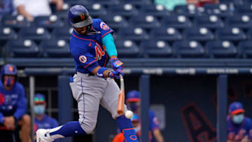 Mar 8, 2021; West Palm Beach, Florida, USA; New York Mets shortstop Francisco Lindor (12) singles in the 3rd inning of the spring training game against the Washington Nationals at The Ballpark of the Palm Beaches. Mandatory Credit: Jasen Vinlove-USA TODAY Sports