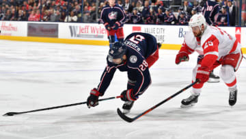 COLUMBUS, OH - OCTOBER 30: Oliver Bjorkstrand #28 of the Columbus Blue Jackets attempts to keep control of the puck away from Mike Green #25 of the Detroit Red Wings during the third period on October 30, 2018 at Nationwide Arena in Columbus, Ohio. (Photo by Jamie Sabau/NHLI via Getty Images)