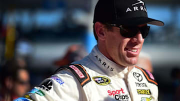 HOMESTEAD, FL - NOVEMBER 20: Carl Edwards, driver of the #19 ARRIS Toyota, stands on the grid prior to the NASCAR Sprint Cup Series Ford EcoBoost 400 at Homestead-Miami Speedway on November 20, 2016 in Homestead, Florida. (Photo by Jared C. Tilton/Getty Images)