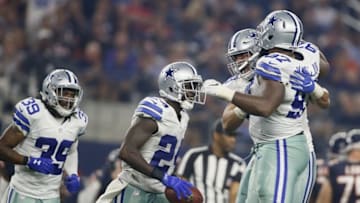 Sep 25, 2016; Arlington, TX, USA; Dallas Cowboys cornerback Morris Claiborne (24) and defensive tackle Terrell McClain (97) and teammates celebrate recovering a fumble in the third quarter against the Chicago Bears at AT&T Stadium. Mandatory Credit: Tim Heitman-USA TODAY Sports