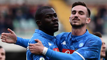 Napoli's Senegalese defender Kalidou Koulibaly (L) celebrates wit Napoli's Spanish midfielder Fabian Ruiz after opening the scoring during the Italian Serie A football match Chievo Verona vs Napoli on April, 2019 at the Marcantonio-Bentegodi stadium in Verona. (Photo by Marco Bertorello / AFP) (Photo credit should read MARCO BERTORELLO/AFP via Getty Images)