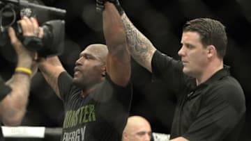 Apr 25, 2015; Montreal, Quebec, CAN; Rampage Jackson (red) has his hand raised after defeating Fabio Maldonado (blue) (not pictured) during their catchweight bout during UFC 186 at Bell Centre. Mandatory Credit: Eric Bolte-USA TODAY Sports