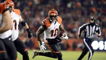Dec 28, 2015; Denver, CO, USA; Cincinnati Bengals wide receiver Mohamed Sanu (12) carries for a touchdown in the second quarter against the Denver Broncos at Sports Authority Field at Mile High. Mandatory Credit: Ron Chenoy-USA TODAY Sports