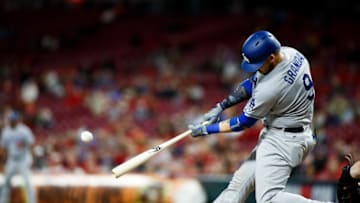 CINCINNATI, OH - SEPTEMBER 10: Yasmani Grandal #9 of the Los Angeles Dodgers hits a homer run in the sixth inning against the Cincinnati Reds at Great American Ball Park on September 10, 2018 in Cincinnati, Ohio. (Photo by Justin Casterline/Getty Images)