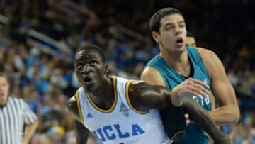 Nov 16, 2014; Los Angeles, CA, USA; UCLA Bruins forward Wanaah Bail (1) and Coastal Carolina Chanticleers forward Uros Ljeskovic (13) under the basket in the first half of the game at Pauley Pavilion. Mandatory Credit: Jayne Kamin-Oncea-USA TODAY Sports