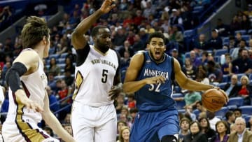 Feb 27, 2016; New Orleans, LA, USA; Minnesota Timberwolves center Karl-Anthony Towns (32) moves past New Orleans Pelicans center Kendrick Perkins (5) during the first half of a game at the Smoothie King Center. Mandatory Credit: Derick E. Hingle-USA TODAY Sports