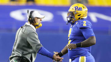 Nov 21, 2020; Pittsburgh, Pennsylvania, USA; Pittsburgh Panthers head coach Pat Narduzzi (left) congratulates Pittsburgh Panthers defensive lineman David Green (2) on a defensive stop against the Virginia Tech Hokies during the second quarter at Heinz Field. Pittsburgh won 47-14. Mandatory Credit: Charles LeClaire-USA TODAY Sports