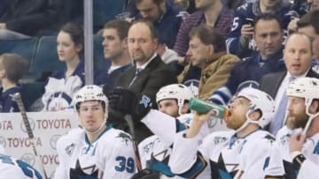 Jan 12, 2016; Winnipeg, Manitoba, CAN; San Jose Sharks head coach Peter DeBoer (L) reacts from behind the bench during the first period against the Winnipeg Jets at MTS Centre. Mandatory Credit: Bruce Fedyck-USA TODAY Sports