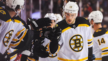 CALGARY, AB - FEBRUARY 21: Charlie Coyle #13 of the Boston Bruins during celebrates with the bench after scoring against the Calgary Flames an NHL game at Scotiabank Saddledome on February 21, 2020 in Calgary, Alberta, Canada. (Photo by Derek Leung/Getty Images)