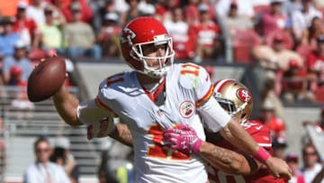 October 5, 2014; Santa Clara, CA, USA; Kansas City Chiefs quarterback Alex Smith (11) passes the football against San Francisco 49ers linebacker Aaron Lynch (59, right) during the second quarter at Levi