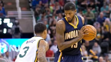 Dec 5, 2015; Salt Lake City, UT, USA; Utah Jazz guard Trey Burke (3) defends against Indiana Pacers forward Paul George (13) during the second half at Vivint Smart Home Arena. The Jazz won in overtime 122-119. Mandatory Credit: Russ Isabella-USA TODAY Sports