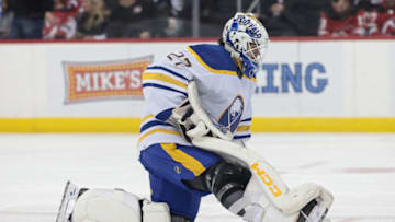 Apr 11, 2023; Newark, New Jersey, USA; Buffalo Sabres goaltender Devon Levi (27) reflects during a stoppage during the first period against the New Jersey Devils at Prudential Center. Mandatory Credit: Vincent Carchietta-USA TODAY Sports