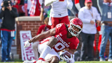 Nov 20, 2021; Norman, Oklahoma, USA; Oklahoma Sooners safety Pat Fields (10) makes an interception during the fourth quarter against the Iowa State Cyclones at Gaylord Family-Oklahoma Memorial Stadium. Mandatory Credit: Kevin Jairaj-USA TODAY Sports