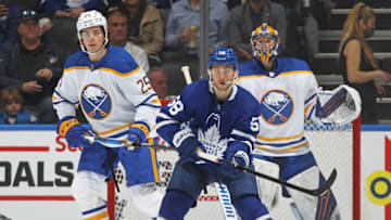 TORONTO, ON - APRIL 12: Owen Power #25 of the Buffalo Sabres watches Michael Bunting #58 of the Toronto Maple Leafs during his first career NHL game at Scotiabank Arena on April 12, 2022 in Toronto, Ontario, Canada. The Sabres defeated the Maple Leafs 5-2. (Photo by Claus Andersen/Getty Images)
