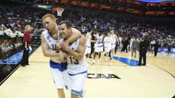 Mar 21, 2015; Louisville, KY, USA; UCLA Bruins guard Kory Alford (2) and UCLA Bruins guard David Brown (13) react after the game against the UAB Blazers in the third round of the 2015 NCAA Tournament at KFC Yum! Center. UCLA wins 92-75. Mandatory Credit: Brian Spurlock-USA TODAY Sports