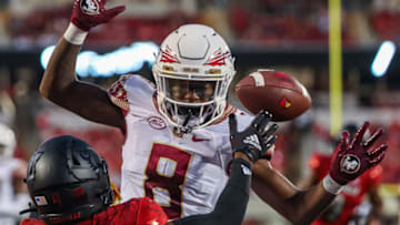 LOUISVILLE, KY - SEPTEMBER 16: Renardo Green #8 of the Florida State Seminoles breaks up the pass and is called for a pass interference against Ahmari Huggins-Bruce #9 of the Louisville Cardinals during the first half at Cardinal Stadium on September 16, 2022 in Louisville, Kentucky. (Photo by Michael Hickey/Getty Images)