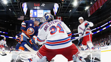 ELMONT, NEW YORK - NOVEMBER 24: Igor Shesterkin #31 of the New York Rangers defends against Zach Parise #11 of the New York Islanders at the UBS Arena on November 24, 2021 in Elmont, New York. (Photo by Bruce Bennett/Getty Images)