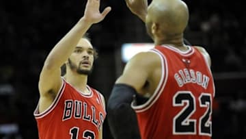 Jan 22, 2014; Cleveland, OH, USA; Chicago Bulls center Joakim Noah (13) and power forward Taj Gibson celebrate in the third quarter against the Cleveland Cavaliers at Quicken Loans Arena. Mandatory Credit: David Richard-USA TODAY Sports