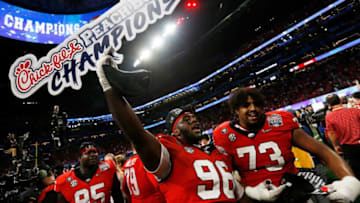 Georgia defensive lineman Zion Logue (96) and Georgia offensive lineman Xavier Truss (73)Syndication Online Athens
