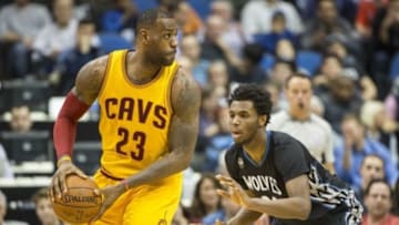Jan 8, 2016; Minneapolis, MN, USA; Cleveland Cavaliers forward LeBron James (23) looks to pass over Minnesota Timberwolves guard Andrew Wiggins (22) in the second half at Target Center. The Cavaliers won 125-99. Mandatory Credit: Jesse Johnson-USA TODAY Sports