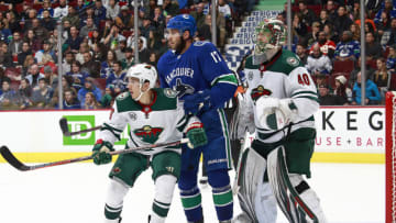 VANCOUVER, BC - DECEMBER 4: Jason Zucker #16 of the Minnesota Wild and Josh Leivo #17 of the Vancouver Canucks stand in front of Devan Dubnyk #40 of the Minnesota Wild during their NHL game at Rogers Arena December 4, 2018 in Vancouver, British Columbia, Canada. (Photo by Jeff Vinnick/NHLI via Getty Images)"n