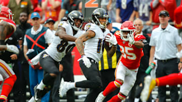 KANSAS CITY, MO - SEPTEMBER 22: Chris Moore #10 of the Baltimore Ravens runs for yards after a pass catch past Charvarius Ward #35 of the Kansas City Chiefs at Arrowhead Stadium on September 22, 2019 in Kansas City, Missouri. (Photo by David Eulitt/Getty Images)