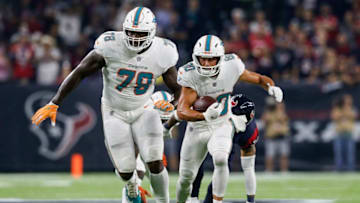 HOUSTON, TX - OCTOBER 25: Danny Amendola #80 of the Miami Dolphins runs after a catch pursued by Tyrann Mathieu #32 of the Houston Texans in the first quarter at NRG Stadium on October 25, 2018 in Houston, Texas. (Photo by Tim Warner/Getty Images)