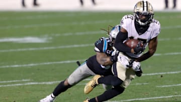 CHARLOTTE, NORTH CAROLINA - JANUARY 03: Wide receiver Emmanuel Sanders #17 of the New Orleans Saints is tackled by linebacker Shaq Thompson #54 of the Carolina Panthers during the second quarter of their game at Bank of America Stadium on January 03, 2021 in Charlotte, North Carolina. (Photo by Jared C. Tilton/Getty Images)