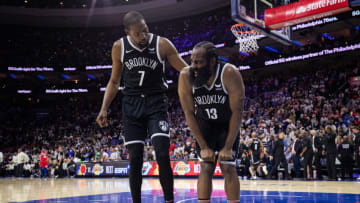 Oct 22, 2021; Philadelphia, Pennsylvania, USA; Brooklyn Nets forward Kevin Durant (7) checks on guard James Harden (13) after a play against the Philadelphia 76ers at Wells Fargo Center. Mandatory Credit: Bill Streicher-USA TODAY Sports