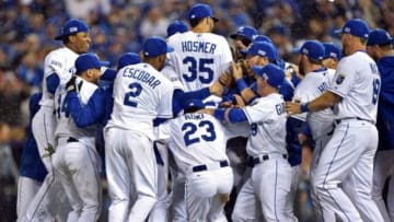 Oct 5, 2014; Kansas City, MO, USA; The Kansas City Royals celebrate after defeating the Los Angeles Angels in game three of the 2014 ALDS baseball playoff game at Kauffman Stadium. The Royals won 8-4 advancing to the ALCS against the Baltimore Orioles. Mandatory Credit: Peter G. Aiken-USA TODAY Sports