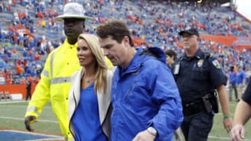 Nov 22, 2014; Gainesville, FL, USA; Florida Gators head coach Will Muschamp and wife Carol walk off after the game after the game against the Eastern Kentucky Colonels at Ben Hill Griffin Stadium. Florida Gators defeated the Eastern Kentucky Colonels 52-3. Mandatory Credit: Kim Klement-USA TODAY Sports