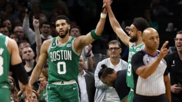 May 25, 2023; Boston, Massachusetts, USA; Boston Celtics forward Jayson Tatum (0) and guard Derrick White (9) react during the first quarter of game five against the Miami Heat in the Eastern Conference Finals for the 2023 NBA playoffs at TD Garden. Mandatory Credit: Winslow Townson-USA TODAY Sports
