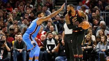 CLEVELAND, OH - JANUARY 20: Paul George #13 of the Oklahoma City Thunder defends against LeBron James #23 of the Cleveland Cavaliers during the game at Quicken Loans Arena on January 20, 2018 in Cleveland, Ohio. NOTE TO USER: User expressly acknowledges and agrees that, by downloading and or using this photograph, User is consenting to the terms and conditions of the Getty Images License Agreement. (Photo by Kirk Irwin/Getty Images)