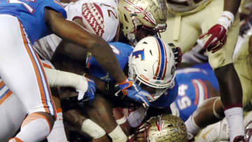 Nov 28, 2015; Gainesville, FL, USA; Florida Gators linebacker Jarrad Davis (40) stops Florida State Seminoles running back Dalvin Cook (4) on the one yard line during the second quarter at Ben Hill Griffin Stadium. Mandatory Credit: Kim Klement-USA TODAY Sports