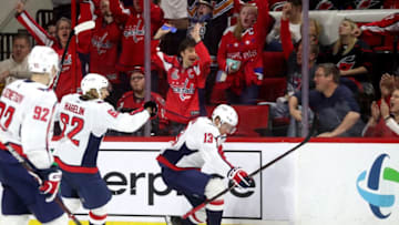 RALEIGH, NC - MARCH 28: Jakub Vrana #13 of the Washington Capitals scores a game tying goal and celebrates with teammate Carl Hagelin #62 during an NHL game on March 28, 2019 at PNC Arena in Raleigh, North Carolina. (Photo by Gregg Forwerck/NHLI via Getty Images)