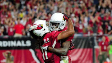Nov 9, 2014; Glendale, AZ, USA; Arizona Cardinals wide receiver John Brown (12) celebrates with wide receiver Larry Fitzgerald (11) after making a 48 yard touchdown catch during the second half against the St. Louis Rams at University of Phoenix Stadium. Mandatory Credit: Matt Kartozian-USA TODAY Sports