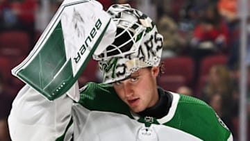 MONTREAL, QC - MARCH 17: Goaltender Jake Oettinger #29 of the Dallas Stars adjusts his mask during the second period against the Montreal Canadiens at Centre Bell on March 17, 2022 in Montreal, Canada. The Dallas Stars defeated the Montreal Canadiens 4-3 in overtime. (Photo by Minas Panagiotakis/Getty Images)