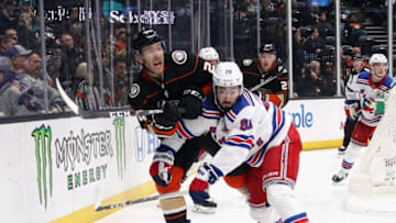 ANAHEIM, CALIFORNIA - DECEMBER 14: Carter Rowney #24 of the Anaheim Ducks skates against Mika Zibanejad #93 of the New York Rangers at the Honda Center on December 14, 2019 in Anaheim, California. (Photo by Bruce Bennett/Getty Images)
