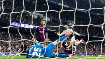 Barcelona's Croatian midfielder Ivan Rakitic (C) scores a goal during the Spanish league football match between Real Madrid CF and FC Barcelona at the Santiago Bernabeu stadium in Madrid on March 2, 2019. (Photo by JAVIER SORIANO / AFP) (Photo credit should read JAVIER SORIANO/AFP/Getty Images)