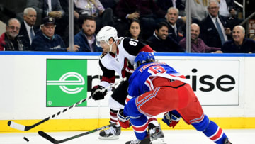 NEW YORK, NEW YORK - OCTOBER 22: Phil Kessel #81 of the Arizona Coyotes and Jacob Trouba #8 of the New York Rangers fight for the puck during their game at Madison Square Garden on October 22, 2019 in New York City. (Photo by Emilee Chinn/Getty Images)
