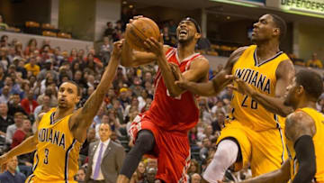 Mar 27, 2016; Indianapolis, IN, USA; Houston Rockets guard Corey Brewer (33) shoots the ball and is fouled by Indiana Pacers guard George Hill (3) in the second half of the game at Bankers Life Fieldhouse. The Indiana Pacers beat the Houston Rockets by the score of 104-101. Mandatory Credit: Trevor Ruszkowski-USA TODAY Sports