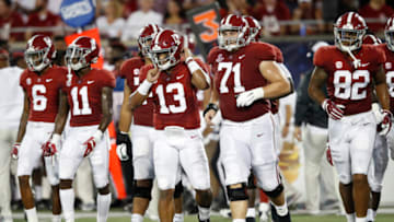 ORLANDO, FL - SEPTEMBER 01: Tua Tagovailoa #13 of the Alabama Crimson Tide leads his teammates onto the field during a game against the Louisville Cardinals at Camping World Stadium on September 1, 2018 in Orlando, Florida. Alabama won 51-14. (Photo by Joe Robbins/Getty Images)