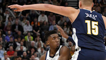 SALT LAKE CITY, UT - OCTOBER 18: Donovan Mitchell #45 of the Utah Jazz controls the ball while being defended by Nikola Jokic #15 of the Denver Nuggets in the first half at Vivint Smart Home Arena on October 18, 2017 in Salt Lake City, Utah. NOTE TO USER: User expressly acknowledges and agrees that, by downloading and or using this photograph, User is consenting to the terms and conditions of the Getty Images License Agreement. (Photo by Gene Sweeney Jr./Getty Images)