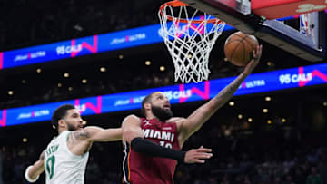 May 19, 2023; Boston, Massachusetts, USA; Miami Heat forward Caleb Martin (16) shoots past Boston Celtics forward Jayson Tatum (0) during the second half of game two of the Eastern Conference Finals for the 2023 NBA playoffs at TD Garden. Mandatory Credit: David Butler II-USA TODAY Sports