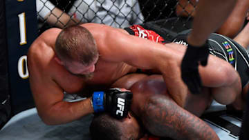 LAS VEGAS, NEVADA - JUNE 05: (L-R) Marcin Tybura of Poland punches Walt Harris in a heavyweight fight during the UFC Fight Night event at UFC APEX on June 05, 2021 in Las Vegas, Nevada. (Photo by Jeff Bottari/Zuffa LLC)
