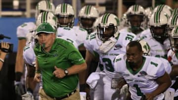 Dec 23, 2014; Boca Raton, FL, USA; Marshall Thundering Herd head coach Doc Holliday leads the team on the field before a game against the Northern Illinois Huskies in the Boca Raton Bowl at FAU Football Stadium. Mandatory Credit: Robert Mayer-USA TODAY Sports