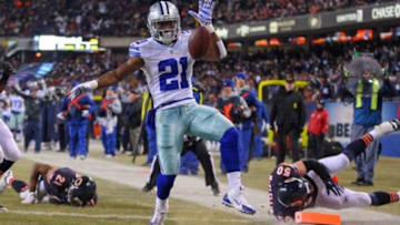 Dec 4, 2014; Chicago, IL, USA; Dallas Cowboys running back Joseph Randle (21) scores a touchdown past Chicago Bears outside linebacker Shea McClellin (50) and strong safety Ryan Mundy (21) during the second half at Soldier Field. Dallas won 41-28. Mandatory Credit: Dennis Wierzbicki-USA TODAY Sports