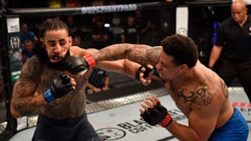 LAS VEGAS, NV - JUNE 12: (R-L) Greg Hardy punches Austen Lane in their heavyweight bout during Dana White's Tuesday Night Contender Series at the TUF Gym on June 12, 2018 in Las Vegas, Nevada. (Photo by Jeff Bottari/DWTNCS LLC)